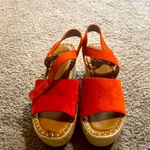 Gently worn red sandals